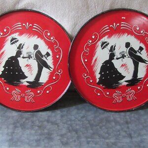 2 vintage enamelware 1960s round painted trays; couple with hearts image